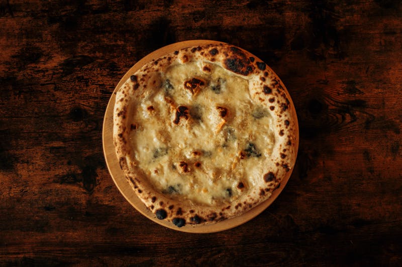 Four Cheese Inferno Pizza with melted cheese blend